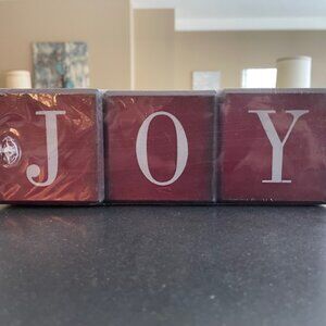 Dark red JOY blocks